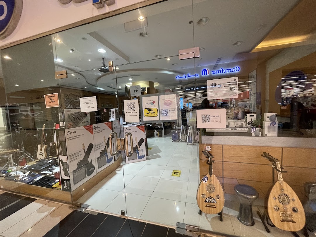 The entrance of a music shop showcasing guitars, amplifiers, and traditional instruments.