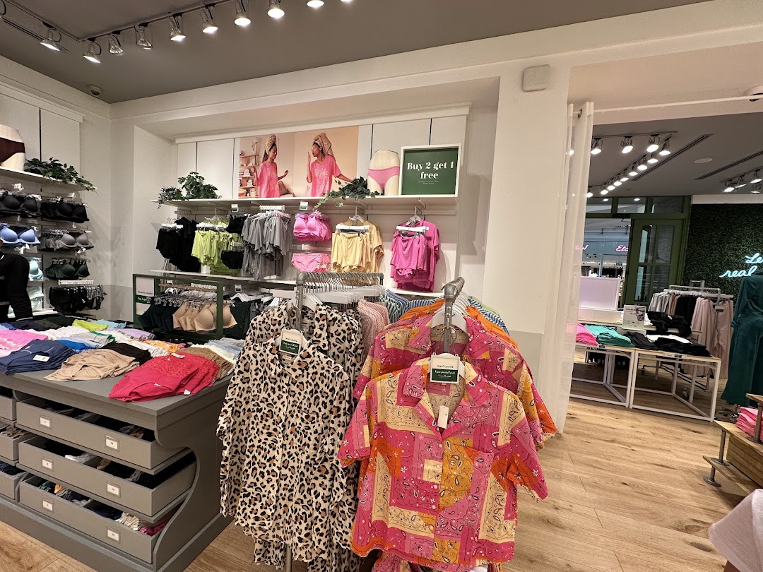 Interior view of an Aerie store showcasing lingerie, loungewear, and apparel on display.