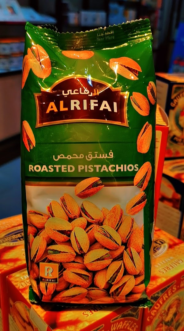 A bag of Al Rifai Roasted Pistachios with images of pistachios on the packaging.