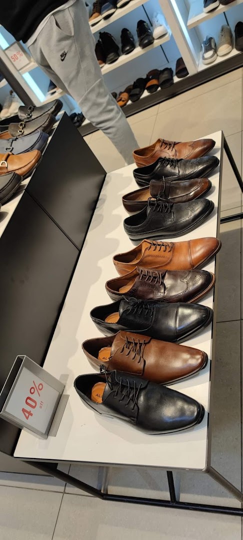 A display of men's dress shoes in various styles and colors at Aldo.