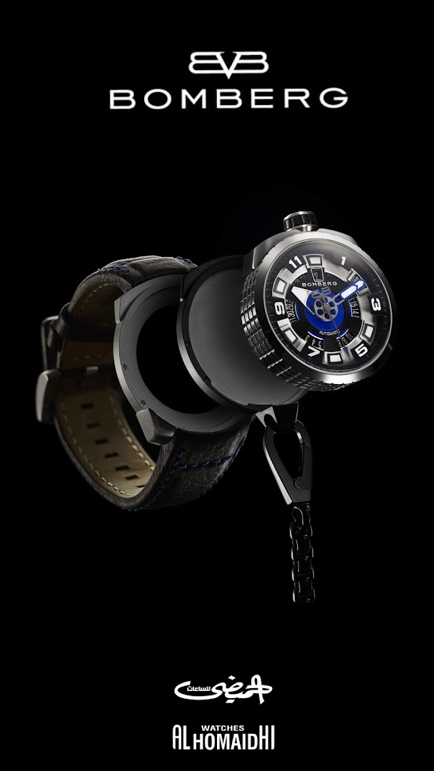 A close-up of a Bomberg automatic watch with a black leather strap and blue stitching.