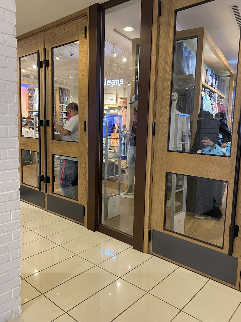 The entrance to an American Eagle store with mannequins and clothing displays visible.