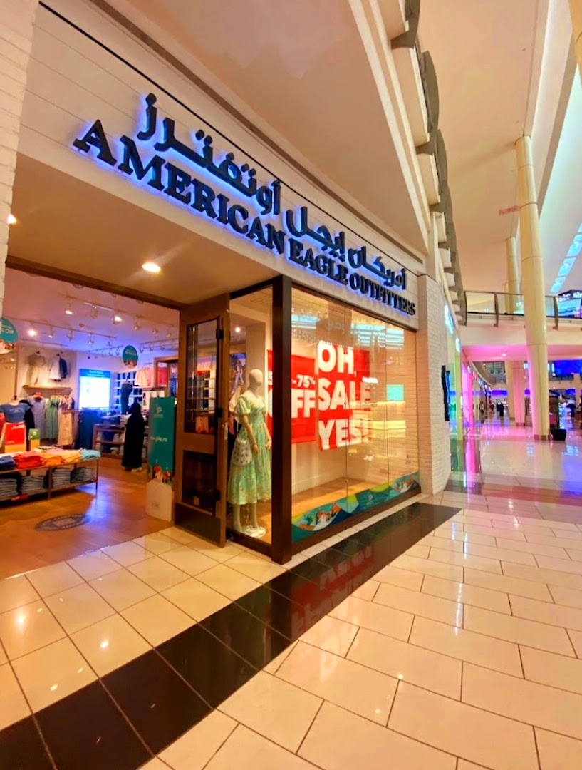 The exterior of an American Eagle Outfitters store with a sale sign in the window.