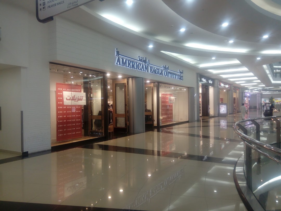 The exterior of an American Eagle Outfitters store in a mall, featuring an 'End of Season Sale' sign.