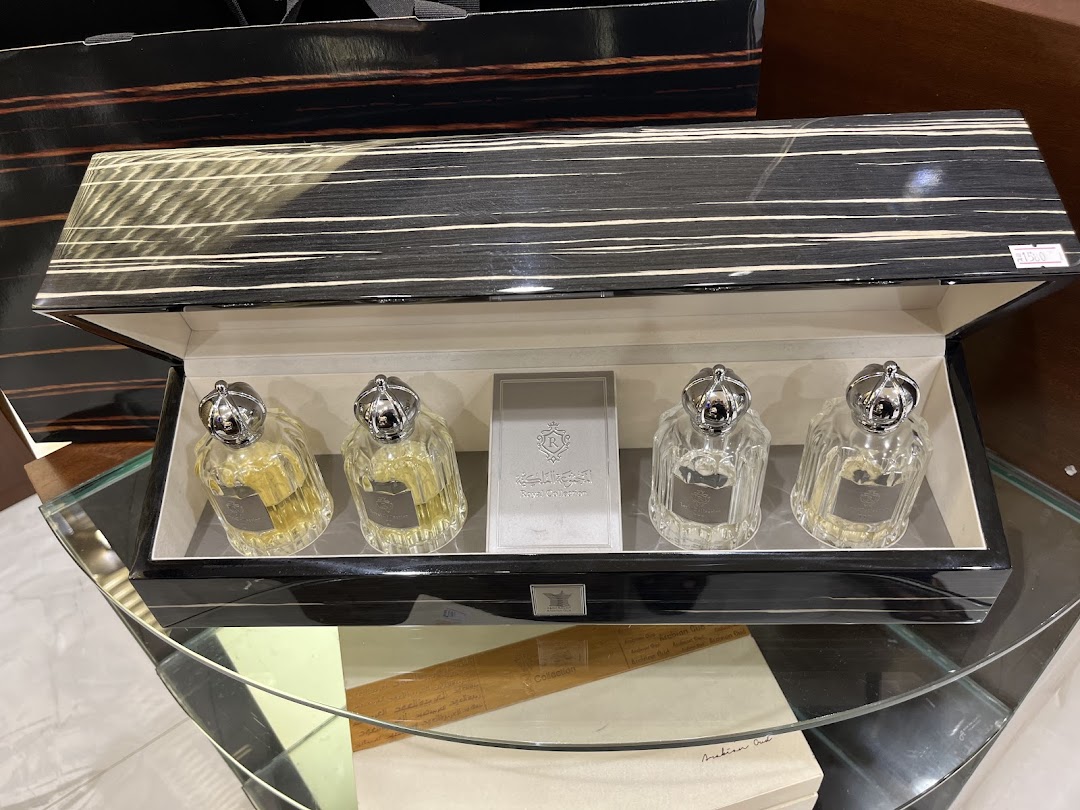A luxurious gift set of Arabian Oud perfumes in an elegant wooden box.
