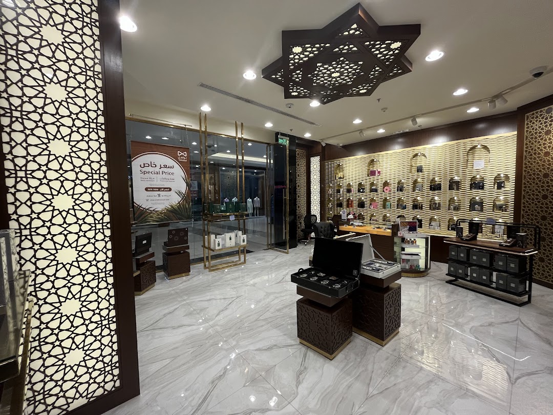 Interior view of Arabian Oud 359, showcasing perfume bottles and display cases.
