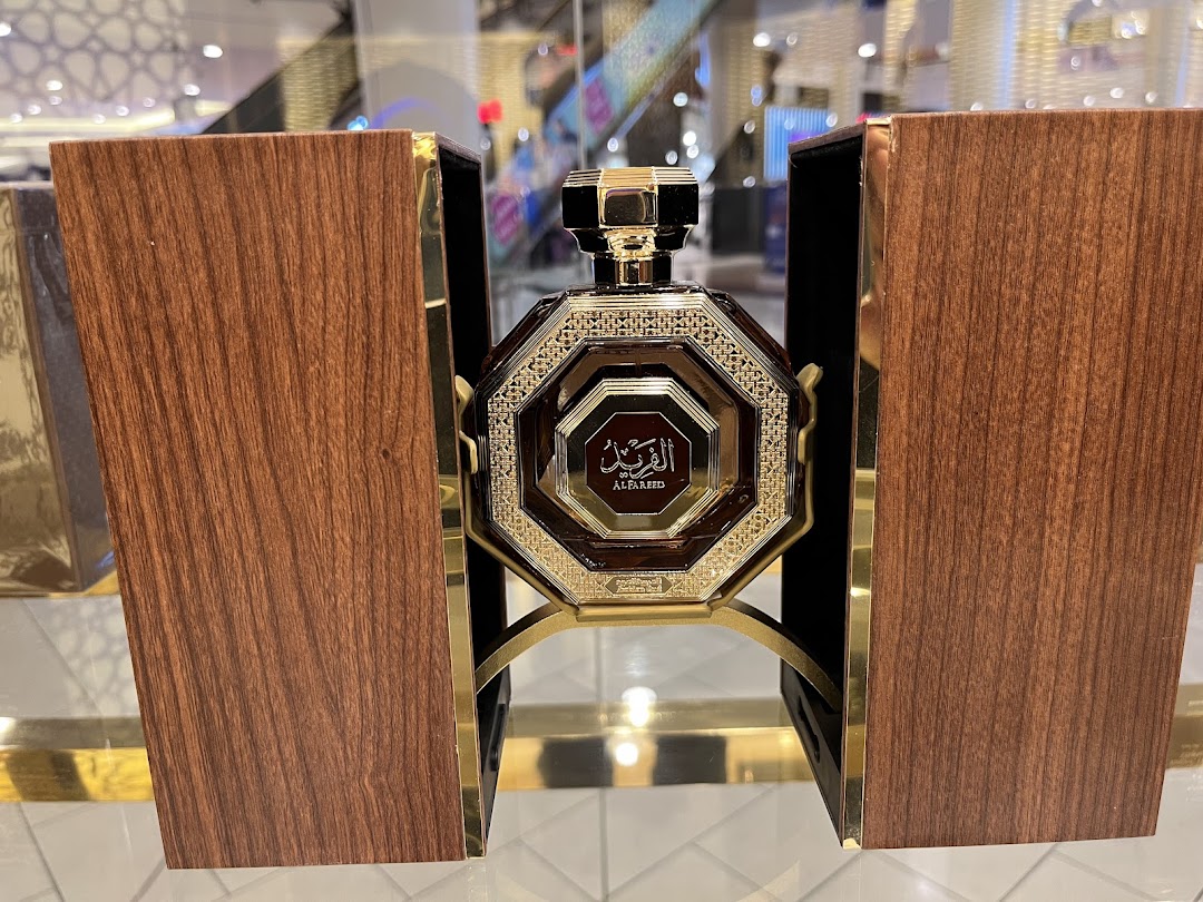 A luxurious perfume bottle from Arabian Oud 359, presented in an elegant wooden and gold display.