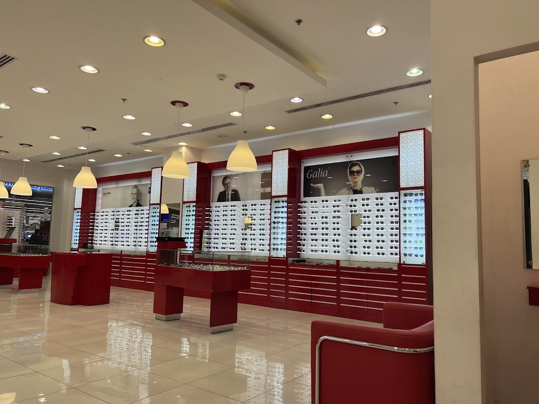Interior of Barakat Optical shop showcasing a wide selection of eyeglasses on display.