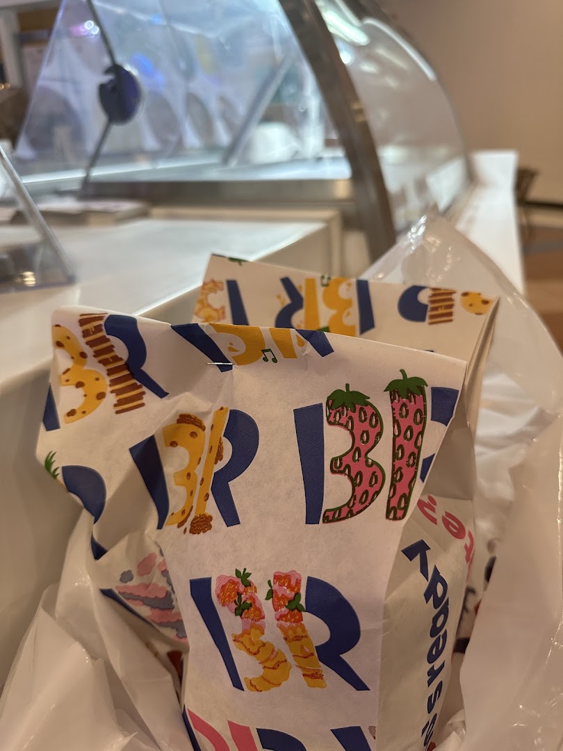 Baskin Robbins branded paper wrapping inside a plastic bag.