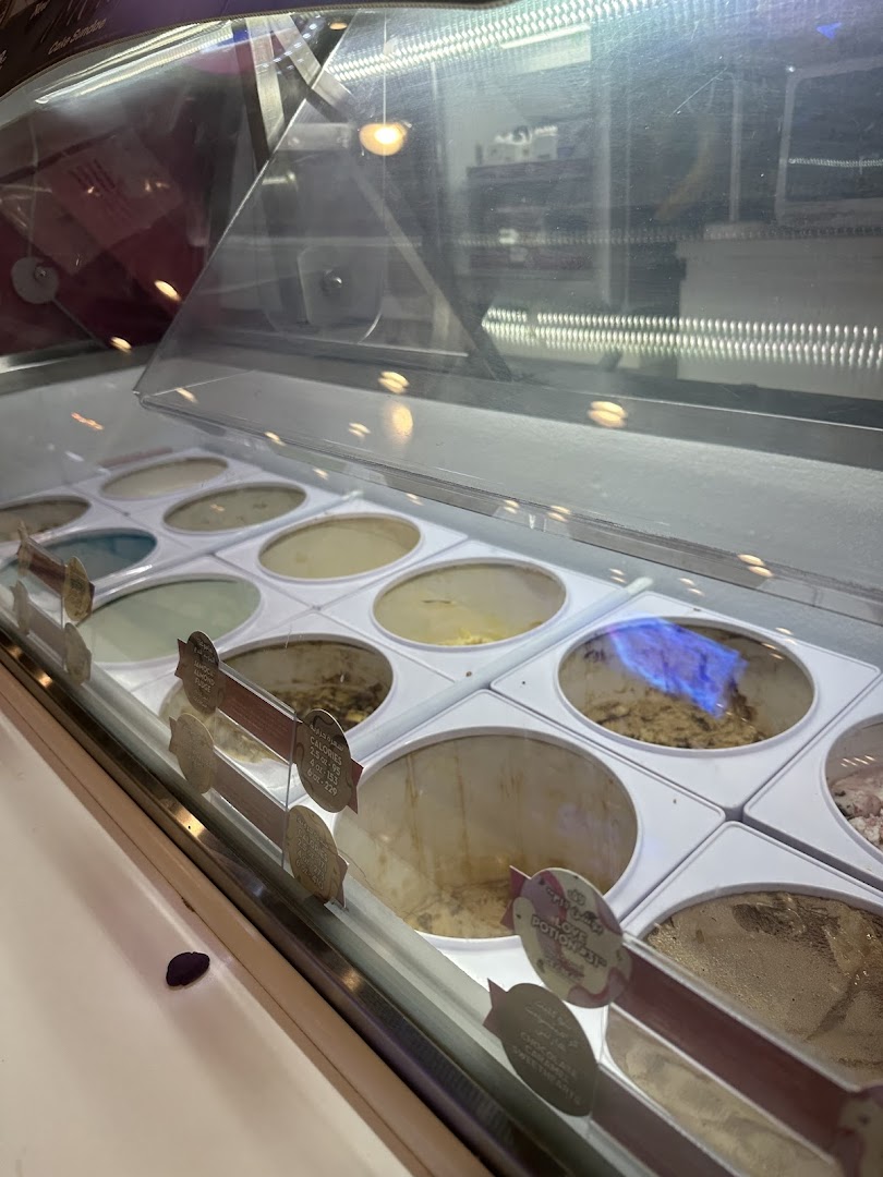 A display case filled with various flavors of ice cream at Baskin Robbins.