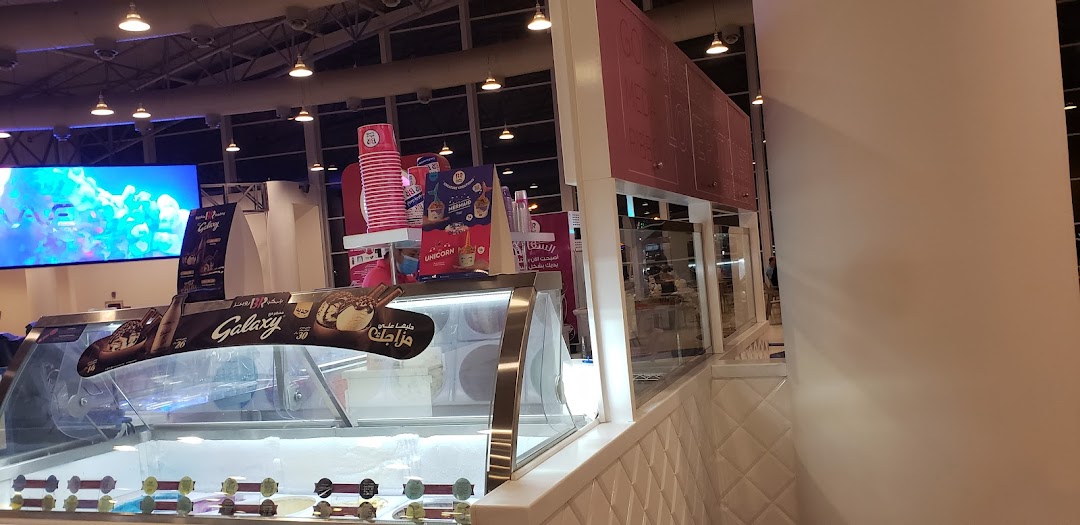 Baskin Robbins ice cream shop with display cases and promotional materials.