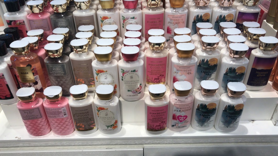 A display of various Bath & Body Works lotions and shower gels in different scents.