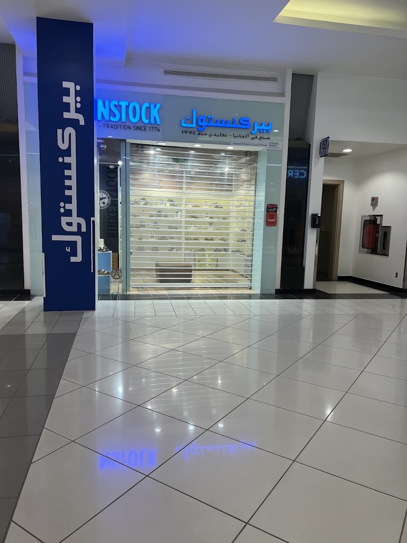 The entrance of a Birkenstock store in a mall, with its logo and merchandise visible.