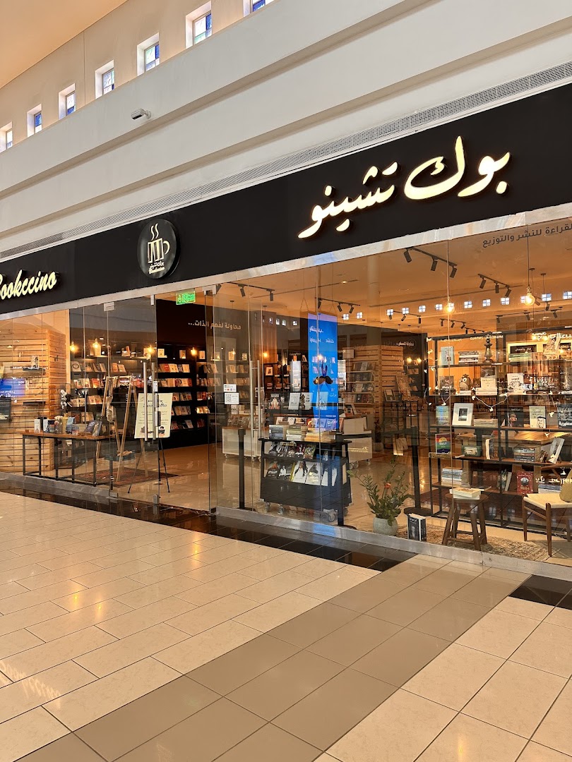 The Bookccino shop front displays books and a cozy reading atmosphere through its glass facade.