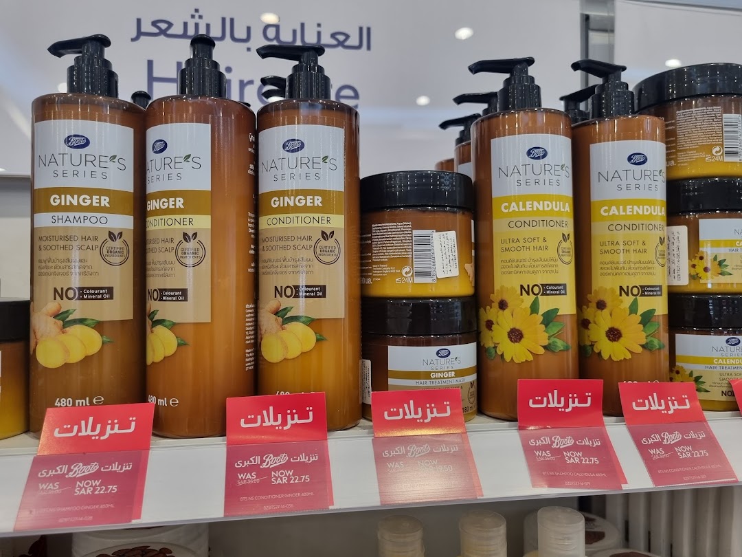 A display of Boots Nature's Series hair care products, including ginger shampoo and conditioner, and calendula conditioner.