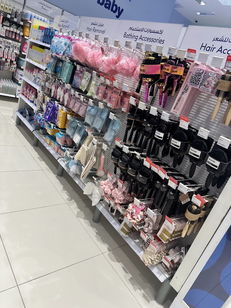 A wide selection of hair accessories and bathing products displayed on shelves in a retail store.