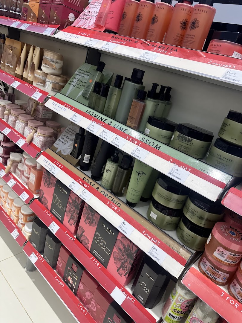 Shelves stocked with Ted Baker beauty products, including lotions, body scrubs, and gift sets.