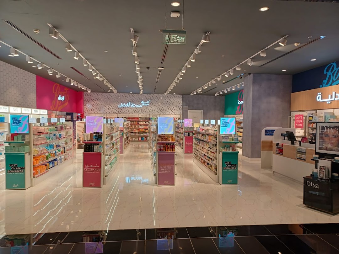 Interior view of a well-lit Boots store showcasing aisles of health and beauty products.