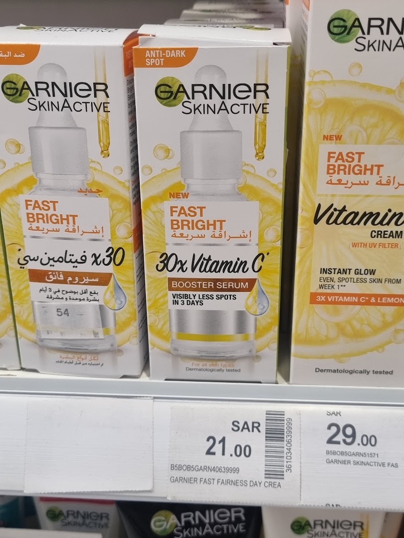 Garnier SkinActive Fast Bright products, including serums and creams, displayed on a shelf.