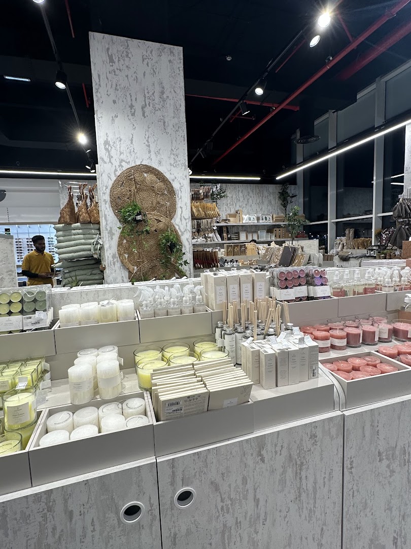Interior view of a retail store displaying a variety of candles and home fragrance products.