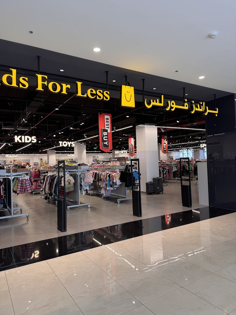 The entrance to Brands For Less, a store with clothing for kids, toys, and sports.