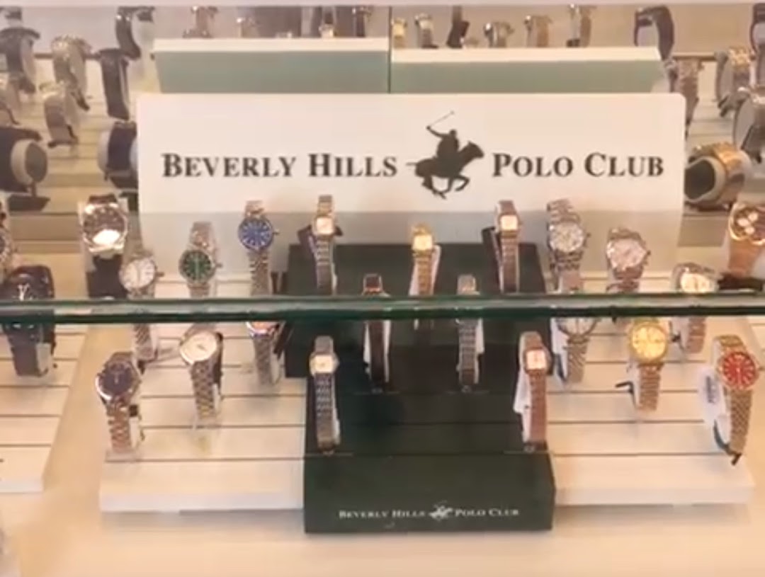 A display case filled with various Beverly Hills Polo Club watches.