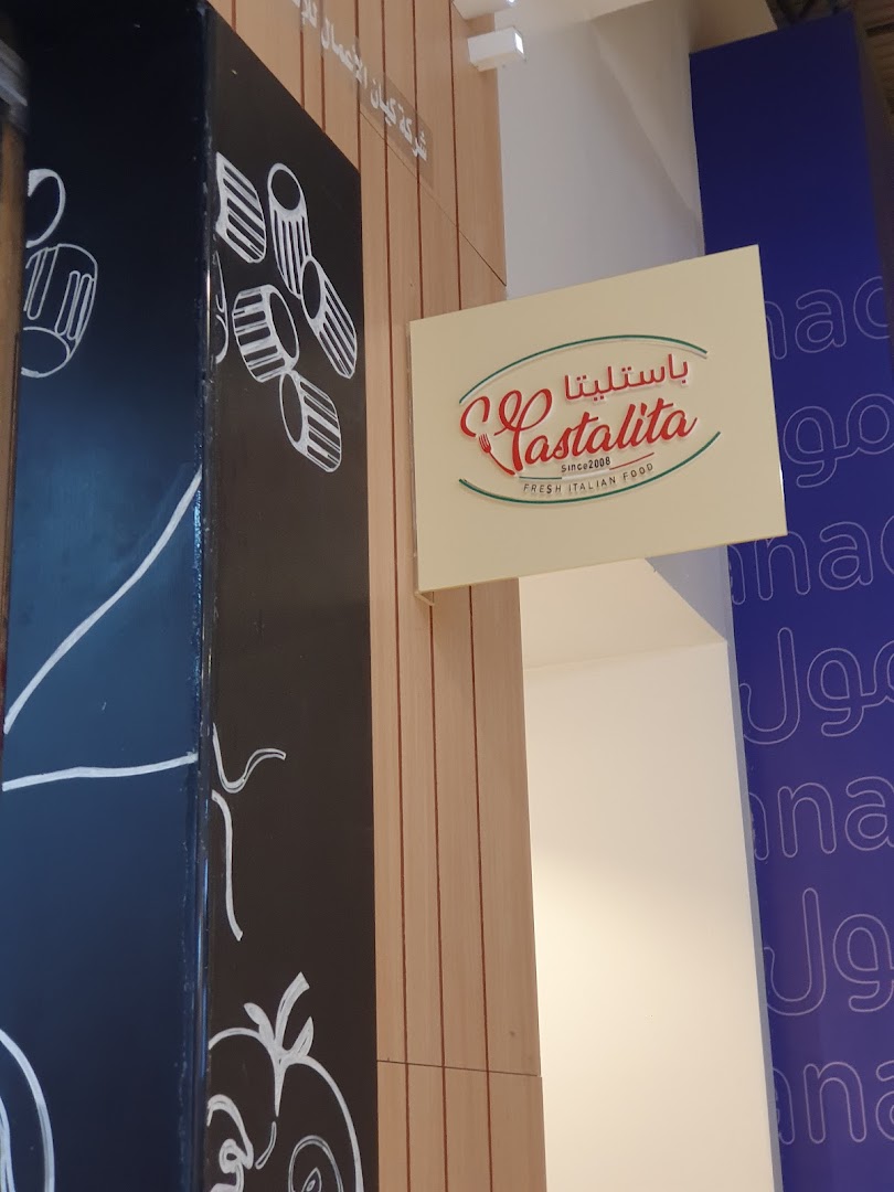 A sign for Castalita, a fresh Italian food restaurant, is displayed on a wooden panel.