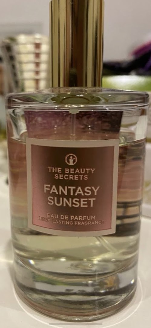A bottle of "Fantasy Sunset" Eau de Parfum from The Beauty Secrets.