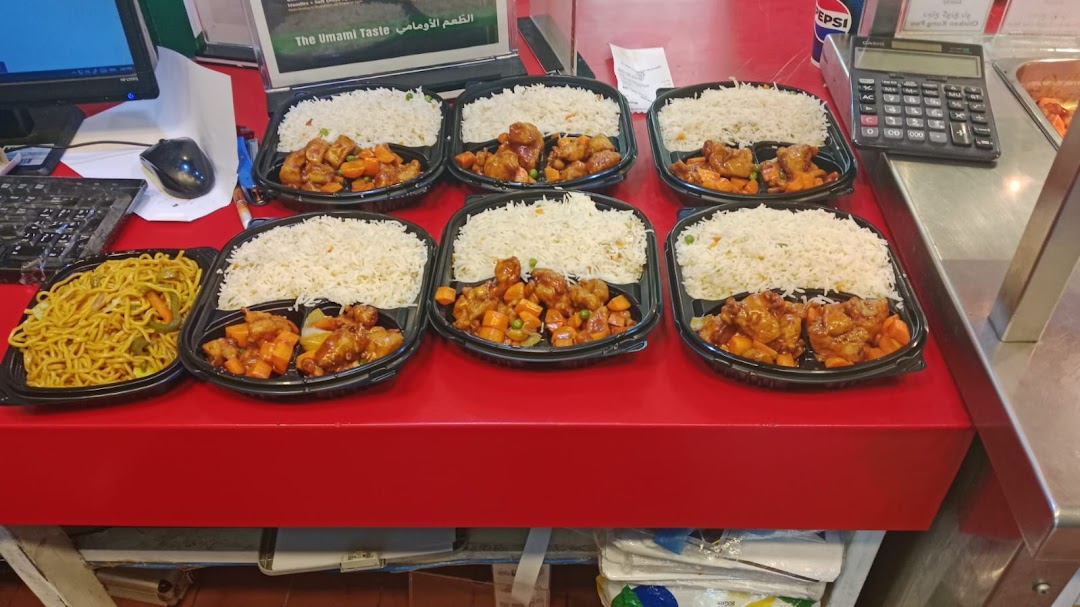 To-go containers filled with rice and chicken with vegetables, plus a container of noodles.
