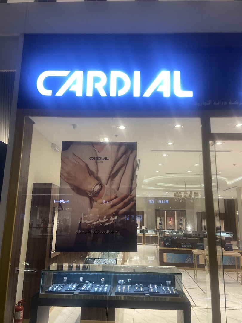 The Cardial watch shop front displays a large illuminated sign and a window showcasing watches.