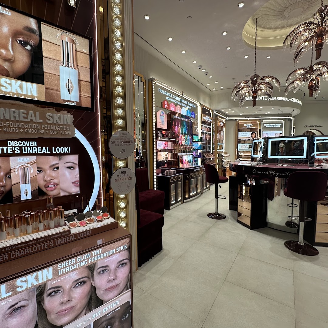 Interior view of a Charlotte Tilbury beauty store showcasing makeup and skincare products.