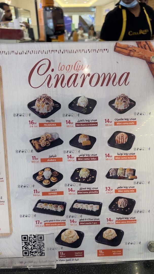 A menu from Cinaroma showcasing various cinnamon roll desserts with prices and calorie information.