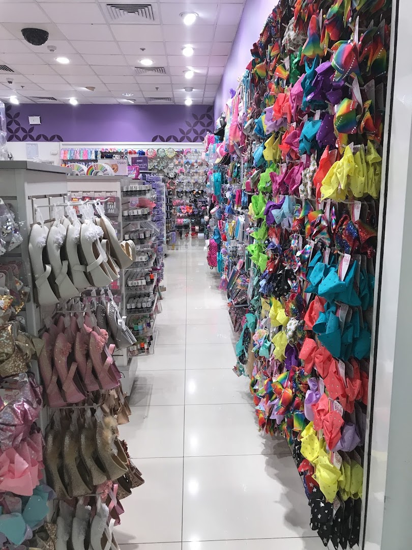 Interior view of Claire's shop, showcasing a wide variety of colorful hair accessories and shoes.