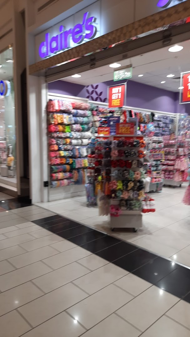 The exterior of a Claire's store, showcasing a wide variety of colorful accessories and jewelry.