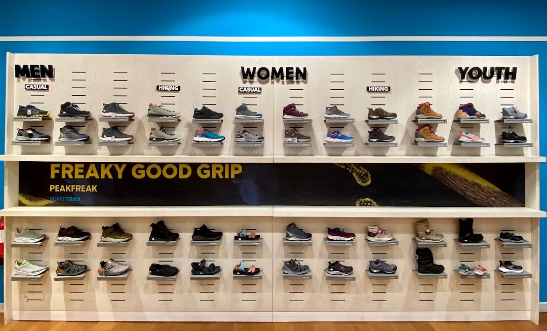 A display of Columbia brand shoes for men, women, and youth, categorized by casual and hiking.