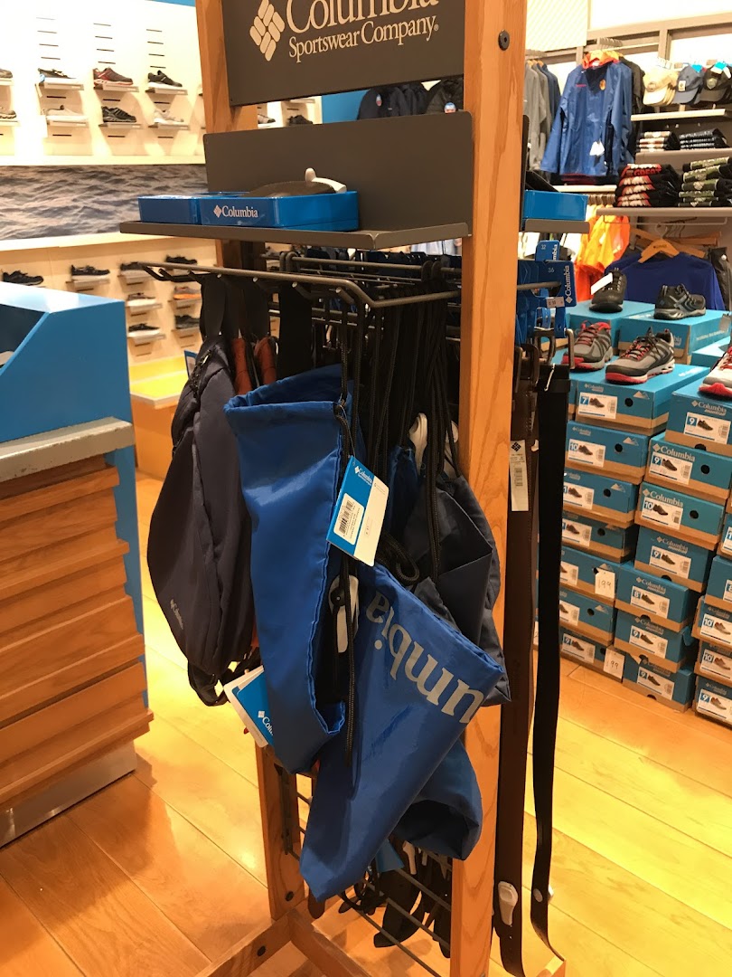 Columbia sportswear store interior with bags, shoes, and apparel on display.