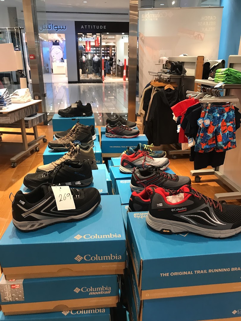 Display of Columbia brand shoes and apparel in a retail store.