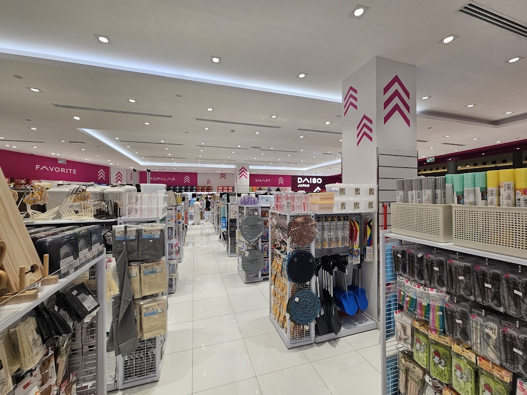 Interior view of a brightly lit Daiso Japan store showcasing a wide variety of household goods and accessories.