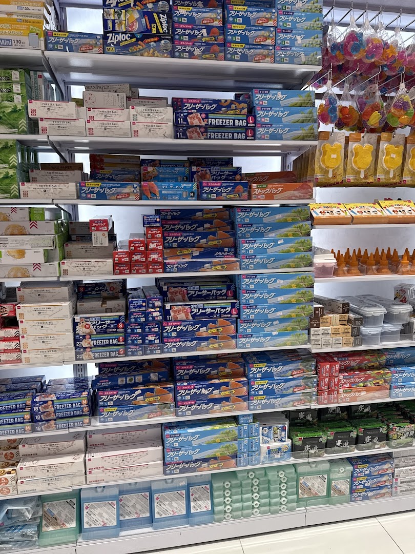 Shelves stocked with various sizes of freezer bags and food storage containers.