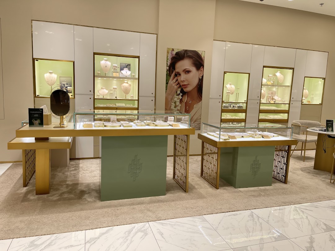 Interior view of a Damas Jewellery store showcasing elegant displays of necklaces and jewelry.
