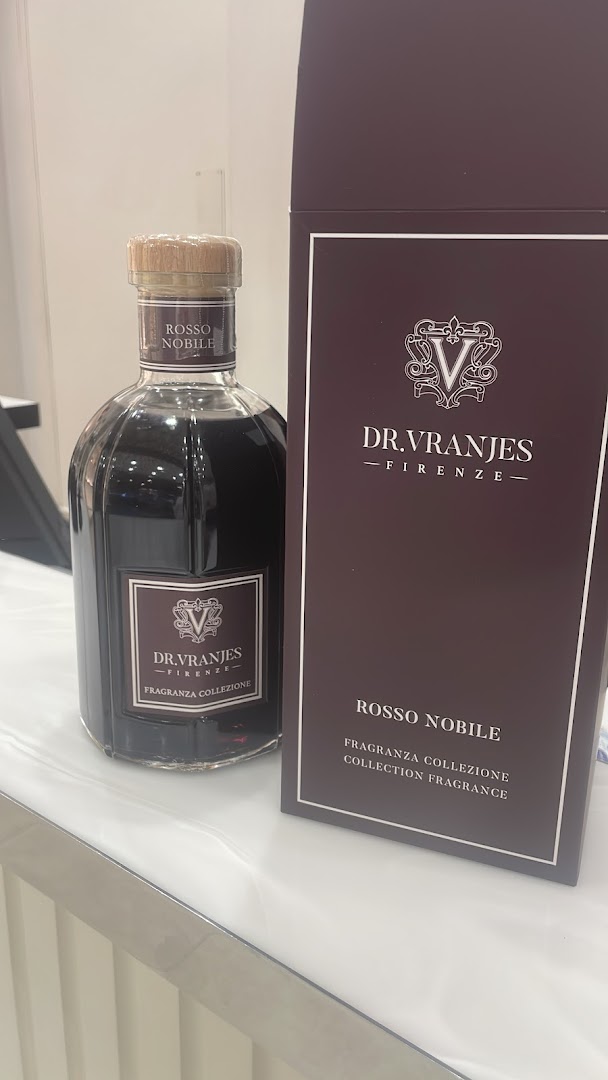 A bottle of Dr. Vranjes Rosso Nobile fragrance next to its packaging.