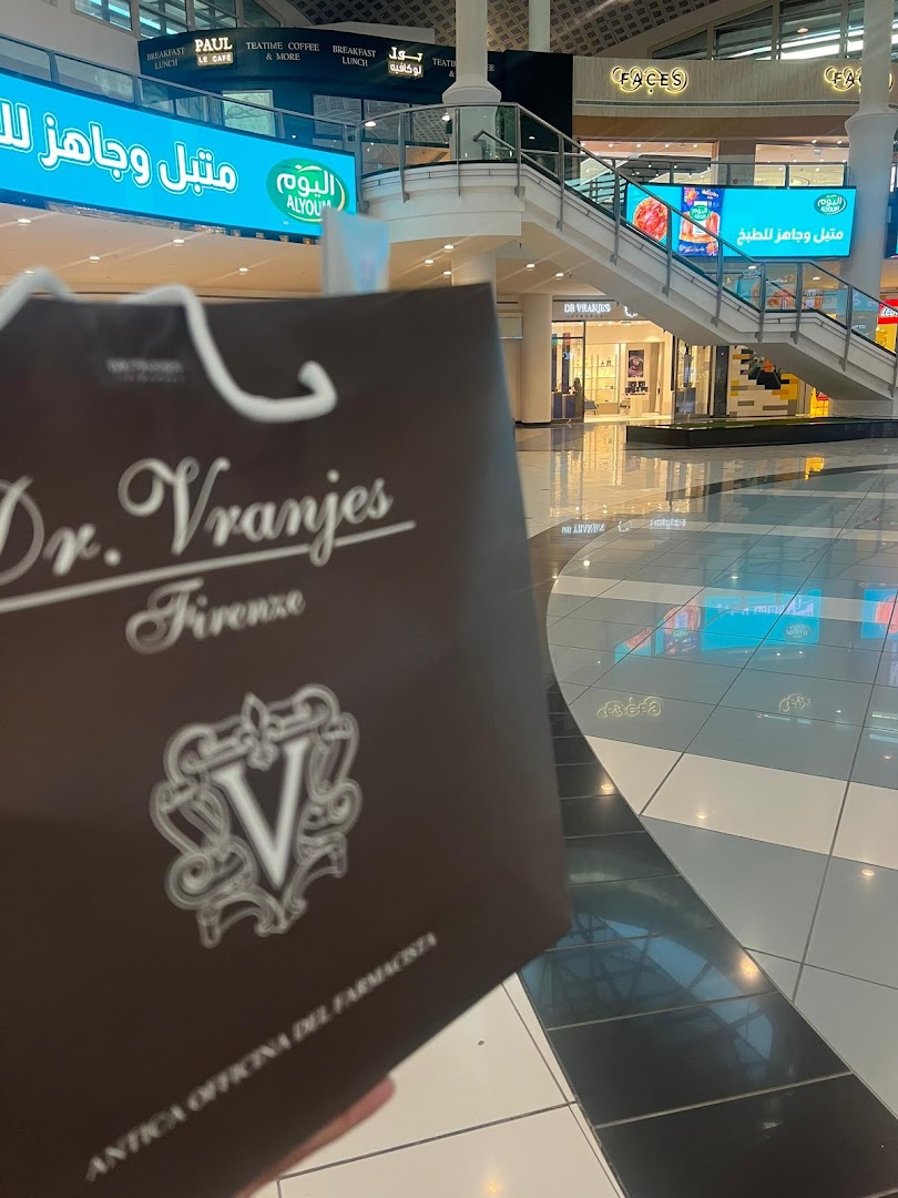 A shopping bag from Dr. Vranjes Firenze in a modern shopping mall.