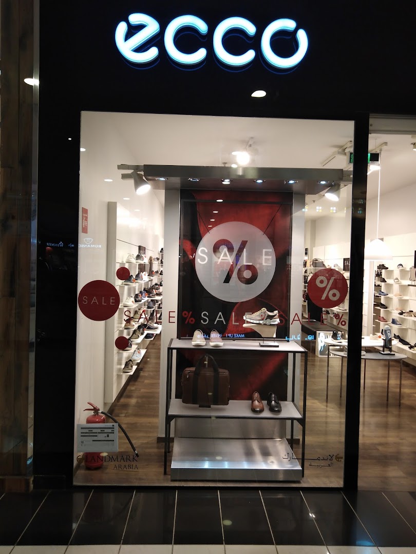 The ECCO shoe store features a sale display with shoes and bags in the window.