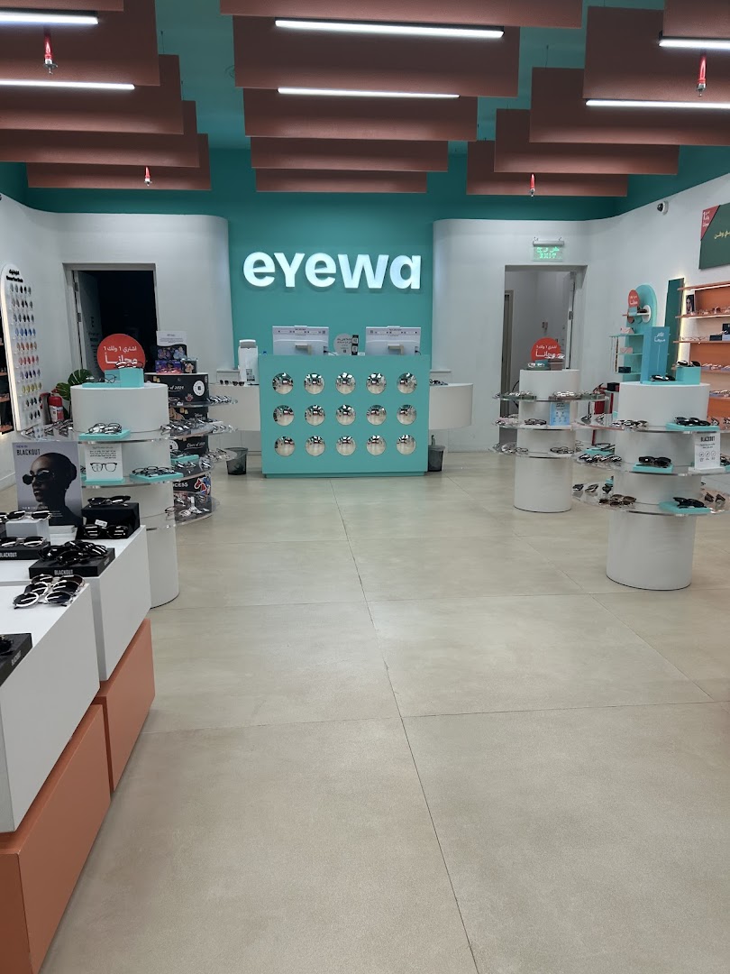 Interior view of an Eyewa store showcasing a wide selection of sunglasses and eyewear.