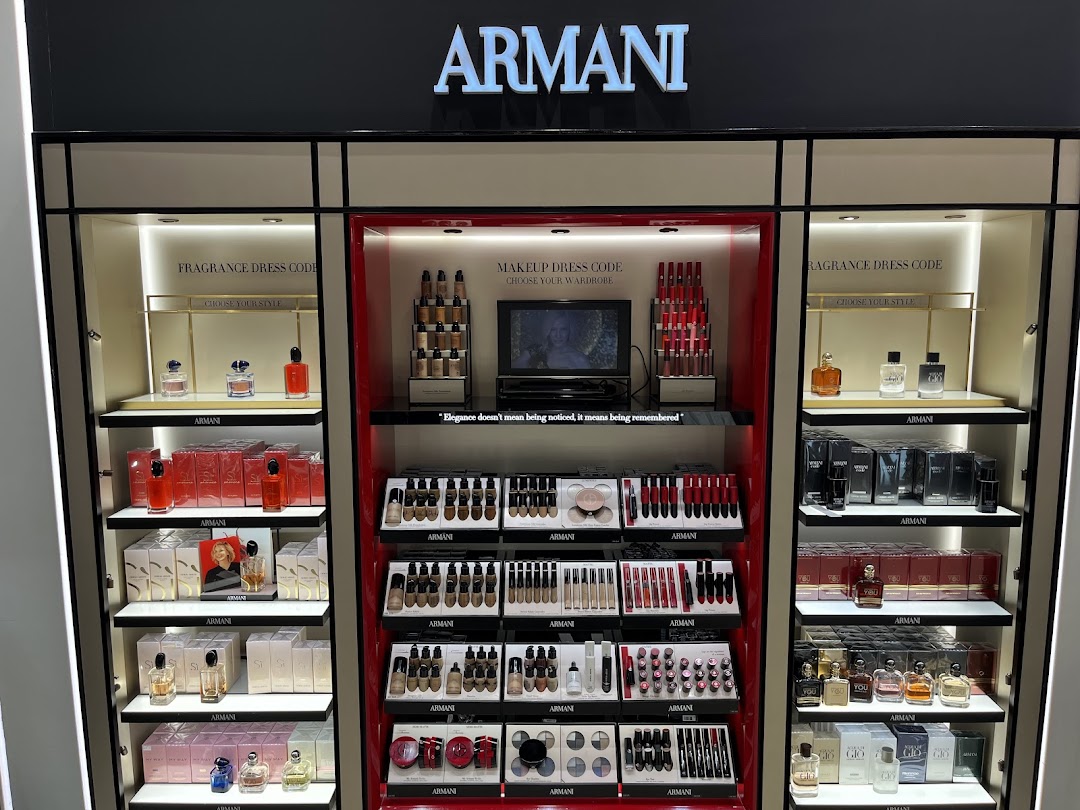 A well-lit display of Armani fragrances and makeup products, showcasing various collections.