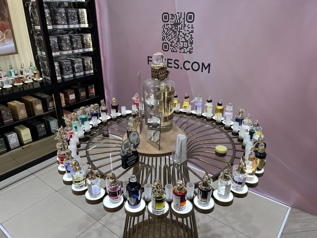 A display of various perfumes in elegant bottles at a retail store.