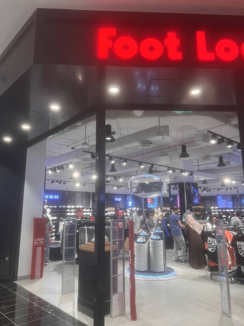 The entrance of a Foot Locker store showcasing athletic footwear and apparel.