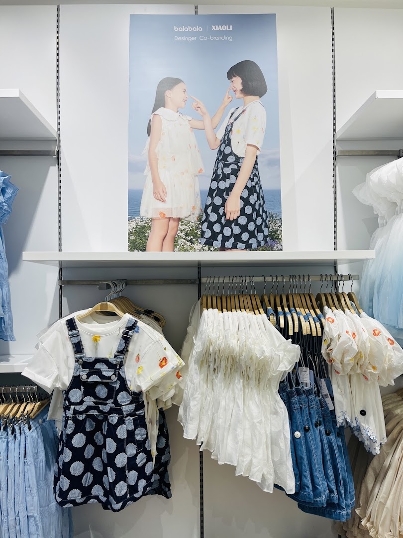 Gingersnaps store interior showcasing children's clothing with a promotional poster.