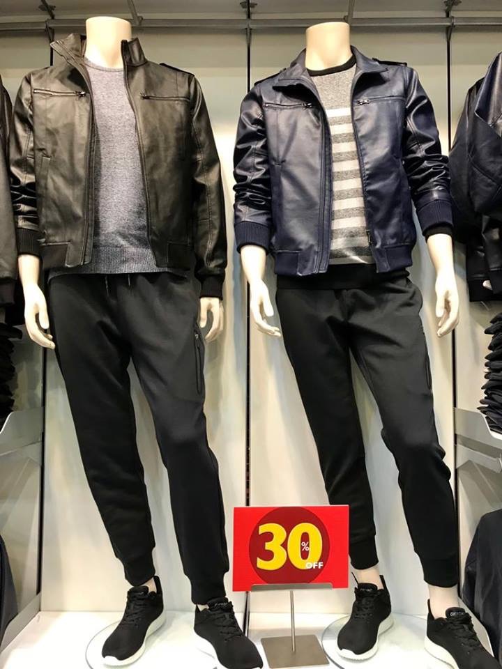 Mannequins display stylish leather jackets and casual pants, with a 30% off sign.