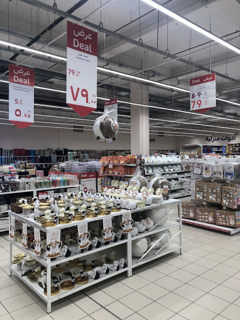 A retail display featuring sheep-themed decorative items and gift boxes on sale.